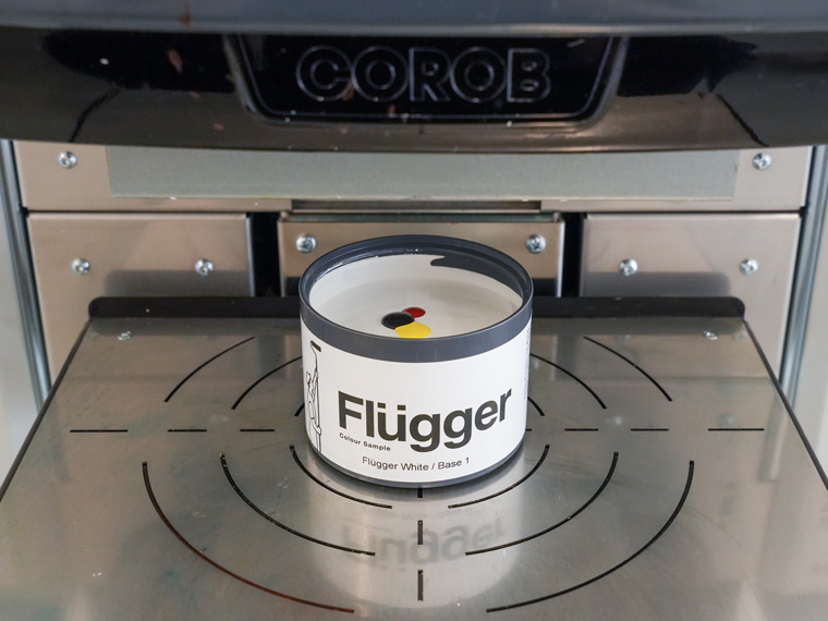 Colour sample being tinted at the tinting machine.