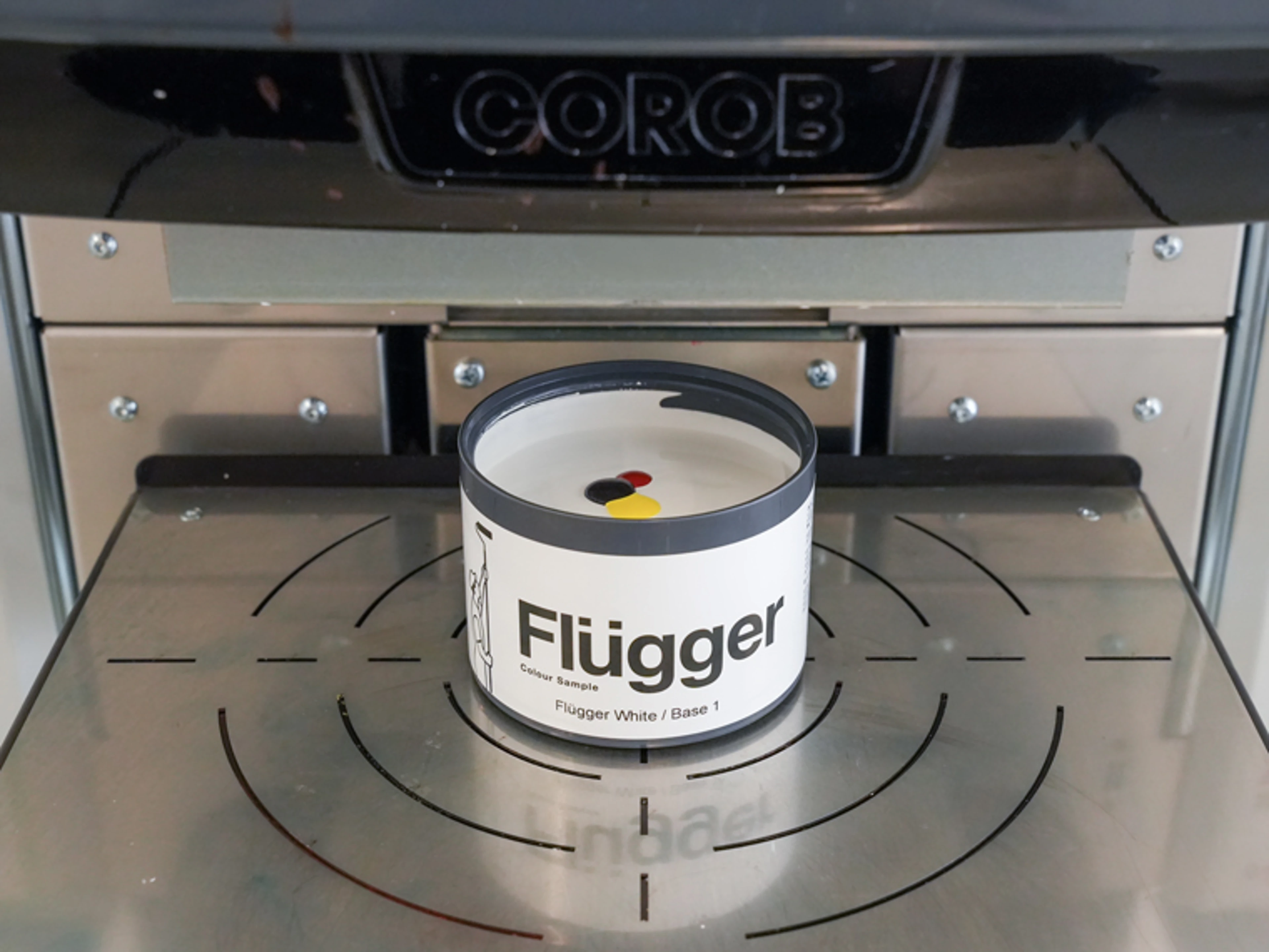 Colour sample being tinted at the tinting machine.
