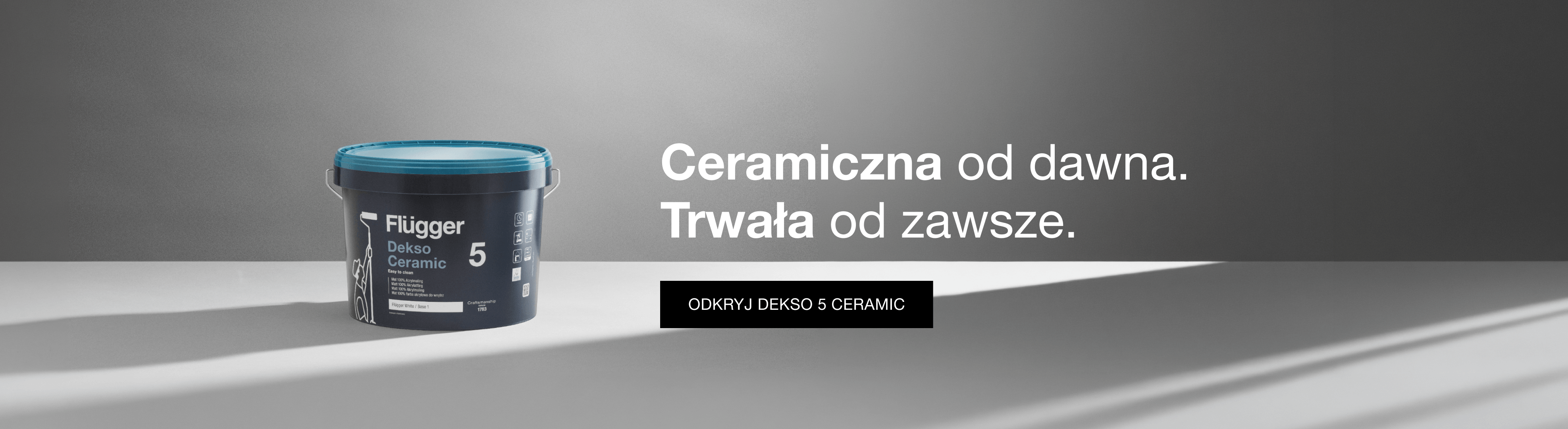 Farba ceramiczna Flügger Dekso 5 Ceramic na szarym tle.
